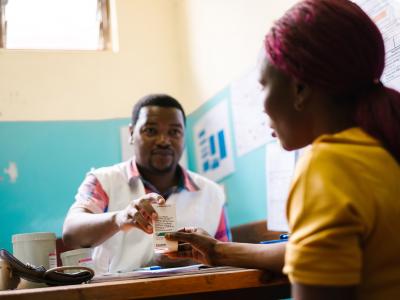 MSF clinical officer James Mponya gives a box of antiretrovirals to a sex worker who is living with HIV at MSF’s one-stop-clinic, Dedza district hospital.