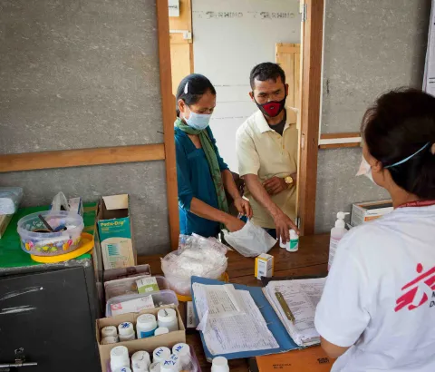Mr and Ms Kimboi, both of whom are living with HIV, picking up their medicines at the MSF Chakpikarong clinic, Thailand, 2019